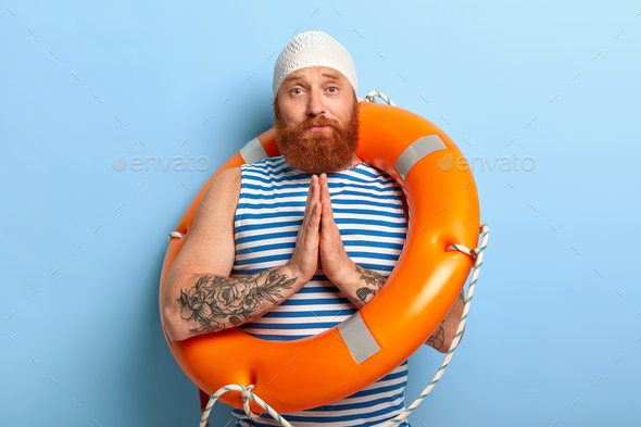 Sad foxy male asks swimming instructor for help, wants to learn swim, presses palms together in pray