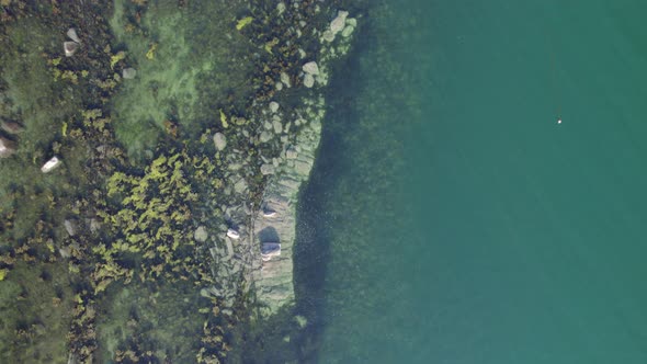 Bird's Eye View of a Rocky Coastline alt