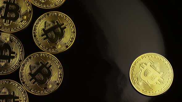 Rotating shot of Bitcoins (digital cryptocurrency) - BITCOIN 0044 alt