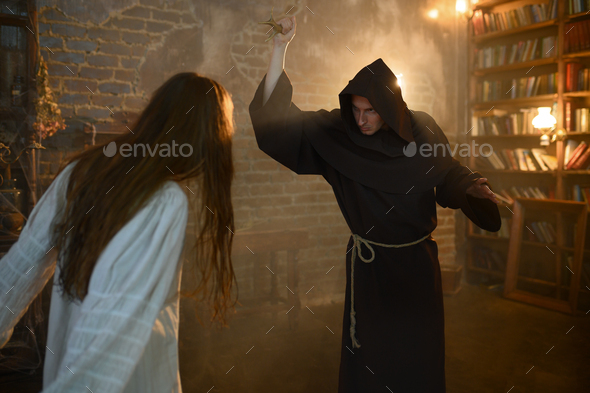 Exorcist casting out satan from crazy woman