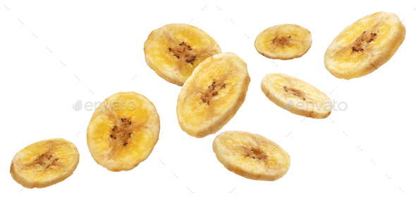 Falling dried banana slices isolated on white background