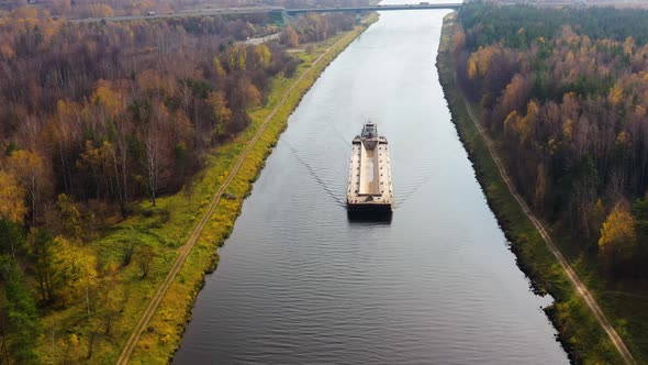 Aerial view:Barge on the River. Autumn Landscape, River Canal Near the Forest alt