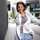 woman in casual clothing with shopping bags Stock Photo by