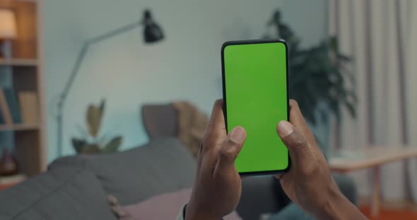 African American Man Texting on Smartphone with Chroma Key Screen