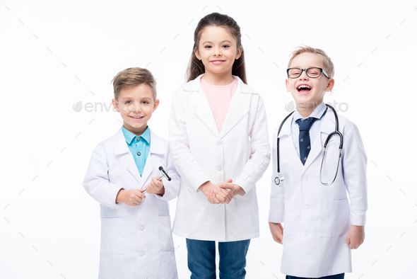 Adorable kids in medical uniform with stethoscope and reflex hammer smiling at camera isolated on