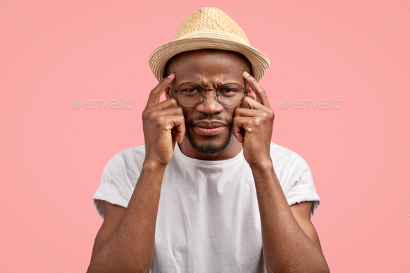 Horizontal Shot Of Frustrated Dark Skinned Guy Keeps Index Fingers On