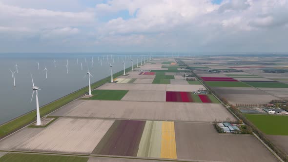 Offshore Windmill Park with Clouds and a Blue Sky Windmill Park in the Ocean Drone Aerial View with alt