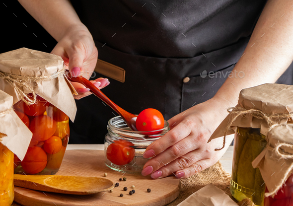 A woman ferments vegetables. - Stock Photo - Images