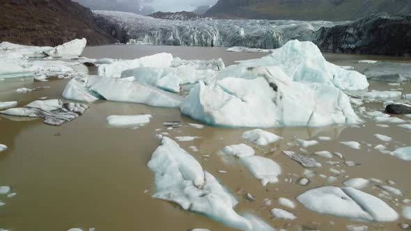 Raising Camera Over Icebergs and Glacier Tongue End