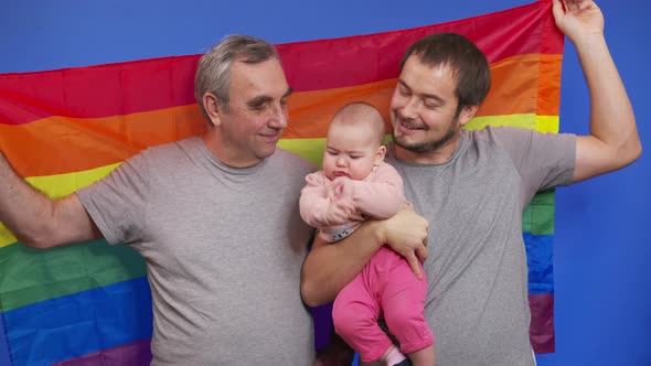 Authentic Shot of Happy Homosexual Male Gay Family with Adopted Toddler Baby Girl Is Smiling in alt