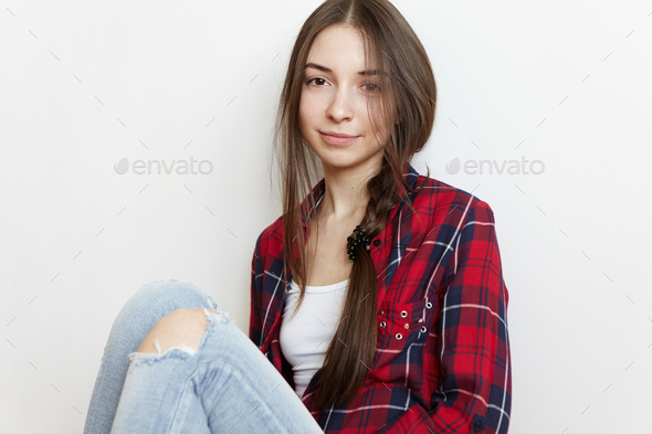 full length portrait of a pretty brunette girl wearing a red shirt