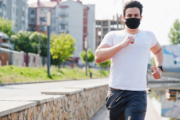 Sport arabian man in black medical face mask