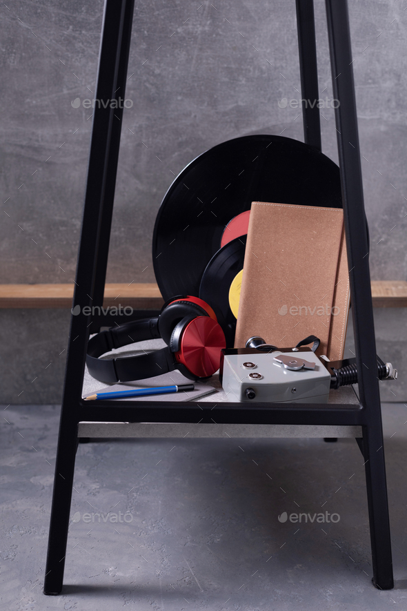 Modern or retro concept at chair near grey wall background texture. Music life style design