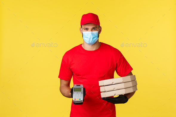 Food delivery, tracking orders, covid-19 and self-quarantine concept. Courier in red uniform cap and