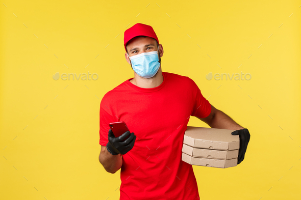 Food delivery, tracking orders, covid-19 and self-quarantine concept. Friendly smiling courier in