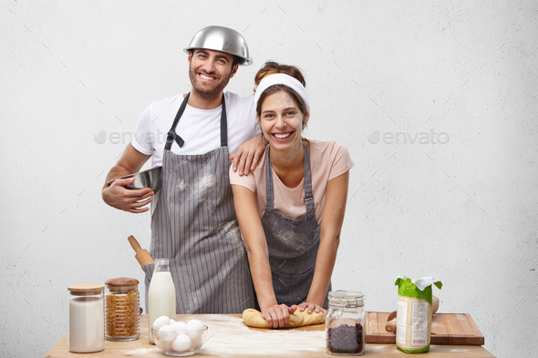 Happy friendly family bakers at kitchen together: smiling beautiful ...