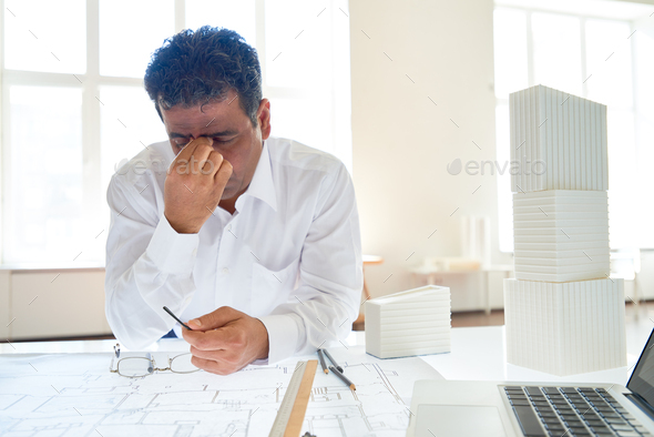 Overworked engineer - Stock Photo - Images