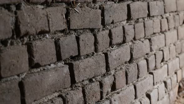 Headers and stretchers of weathered bricks close-up slow tilt 4K 2160p 30fps UltraHD footage - Old h alt