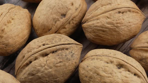 many organic walnuts close up alt