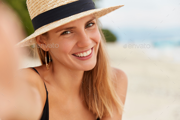 Woman in White Dress Posing at a Beach · Free Stock Photo