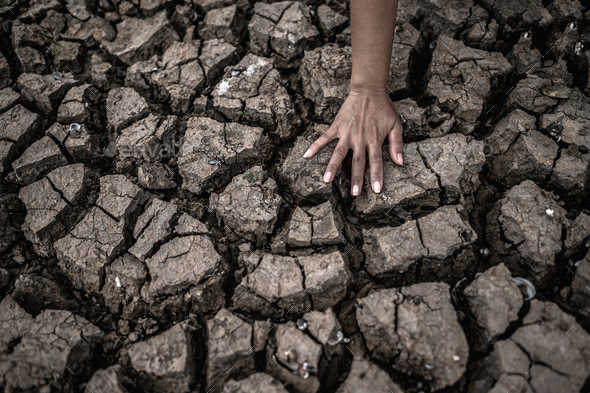 Hands on dry ground,Global warming and water crisis