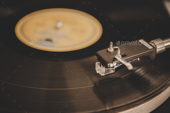 Spinning Record Player With Vintage Vinyl, Turntable Player And Vinyl Record.  Stock Photo by Johnstocker