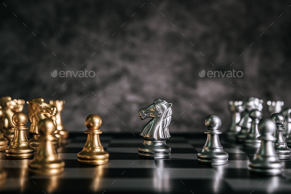 Free Photo  Gold and silver chess on chess board game for business  metaphor leadership concept