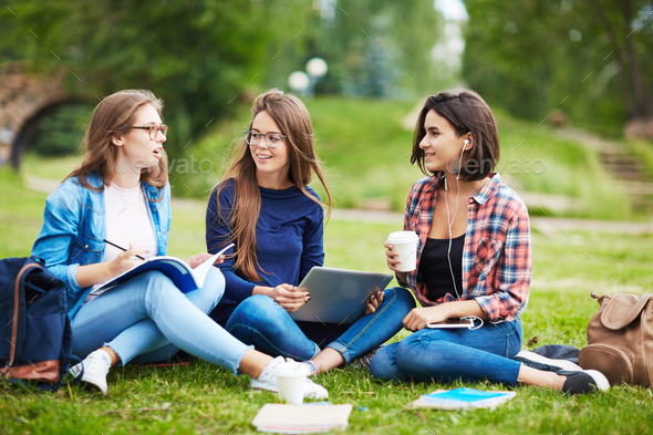 Conversation of girls Stock Photo by Pressmaster | PhotoDune