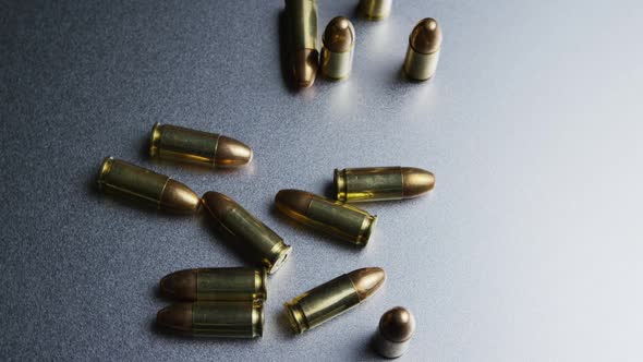 Cinematic rotating shot of bullets on a metallic surface - BULLETS 046 alt