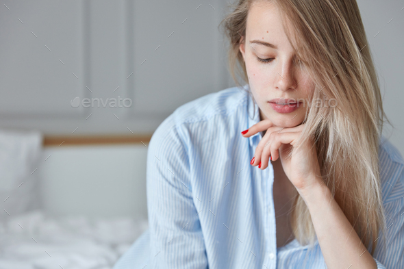 Model Posing in Pants on Bed · Free Stock Photo