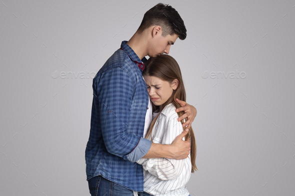 Loving husband calms his wife, forgives, support and reconciles after quarrel