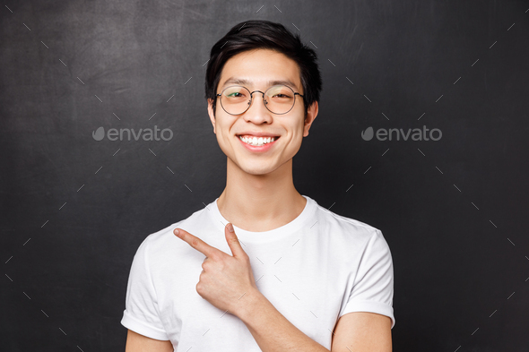 Close-up portrait of cheerful young adult guy start own business on internet platform, wearing
