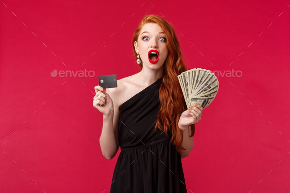 Luxury, beauty and money concept. Portrait of lucky and amazed girl express disbelief as receiving