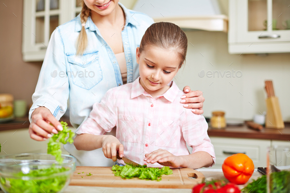 Cutting salad Stock Photo by Pressmaster | PhotoDune