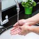 Hand washing with Chrome faucet over the washbasin in modern bathroom - PhotoDune Item for Sale