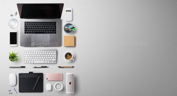 Desk, gadgets and office supplies. Flat lay. Wooden desk. Stock Photo by  halfpoint