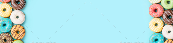 donuts on blue background, top view - Stock Photo - Images