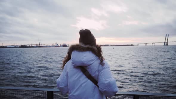 Norwegian Cloudy Sea. The Girl Is Enjoying the View. Scandinavian Foggy Seascape. Cloudy Dramatic alt