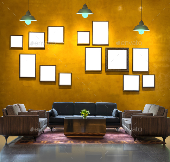Lobby area of a hotel over the Vintage wall background with photo frame and  light, Interior gallery Stock Photo by thananit_s