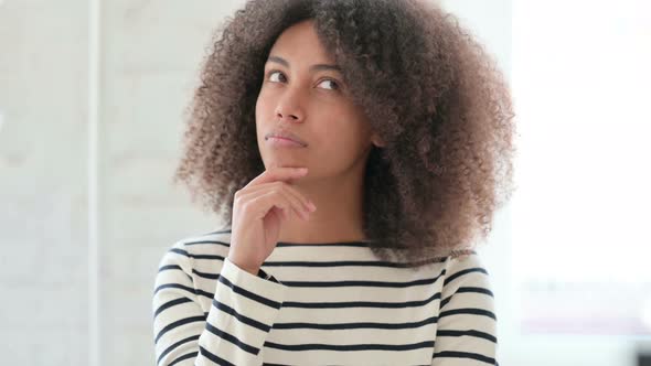 African Woman Thinking and Getting Idea alt