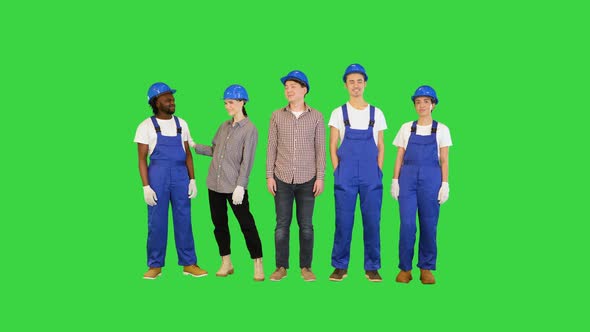 Group of Architects Engineers Workers at a Construction Site Smiling on Camera on a Green Screen alt