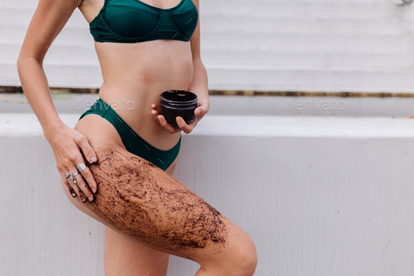 Outdoor shot of woman with coffee body scrub
