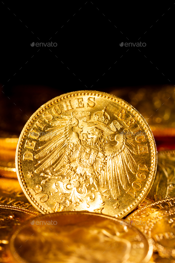 Gold coins over dark background