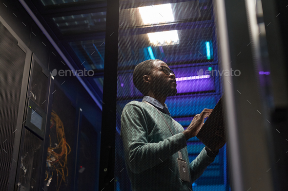 African American Network Engineer in Server Room