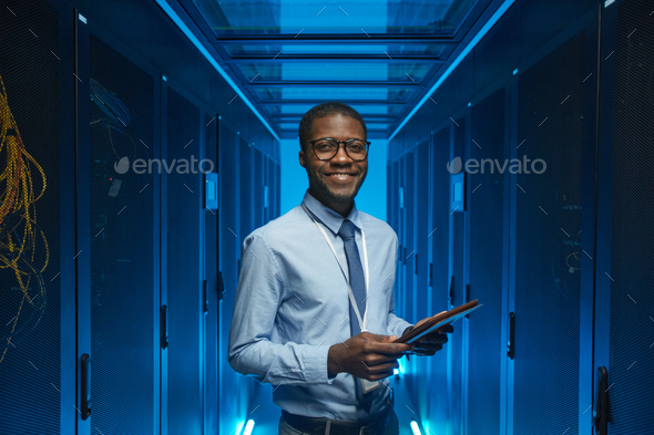 Smiling African American Man in Data Center - Stock Photo - Images