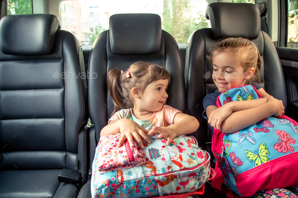 Children In The Car Go To School Happy Sweet Faces Of Sisters Stock Photo By Puhimec