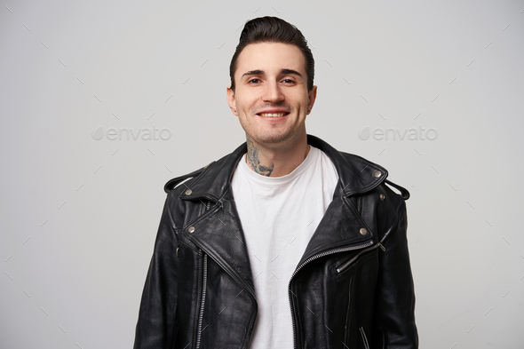 Indoor photo of attractively smiling young rocker man Stock Photo by ...