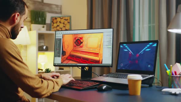 Male Game Developer Typing on Keyboard alt