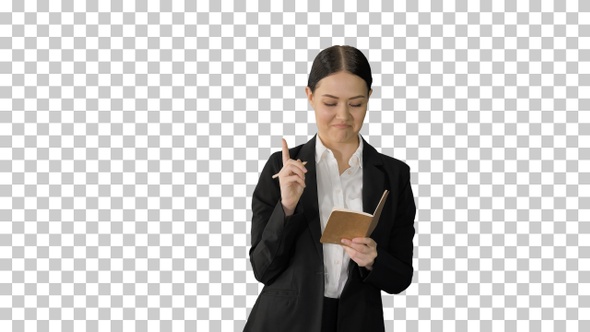 Concentrated woman in a suit writing business, Alpha Channel alt