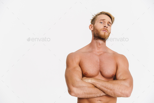 Handsome Caucasian Shirtless Man Posing With Arms Crossed Stock Photo